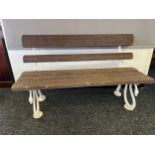 Antique cast iron bench, wooden slat back and seat raised on cast iron ends formed to look like a