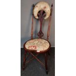 Arts & Crafts mahogany chair, the high back with floral and gold trim material head rest above a