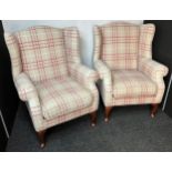 A Pair of contemporary tartan upholstered gull wing arm chairs.