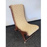 A 19th century curved nursing chair. [83x60cm]