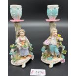 A pair of 19th century Meissen figure candle stick holders. [15cm high]