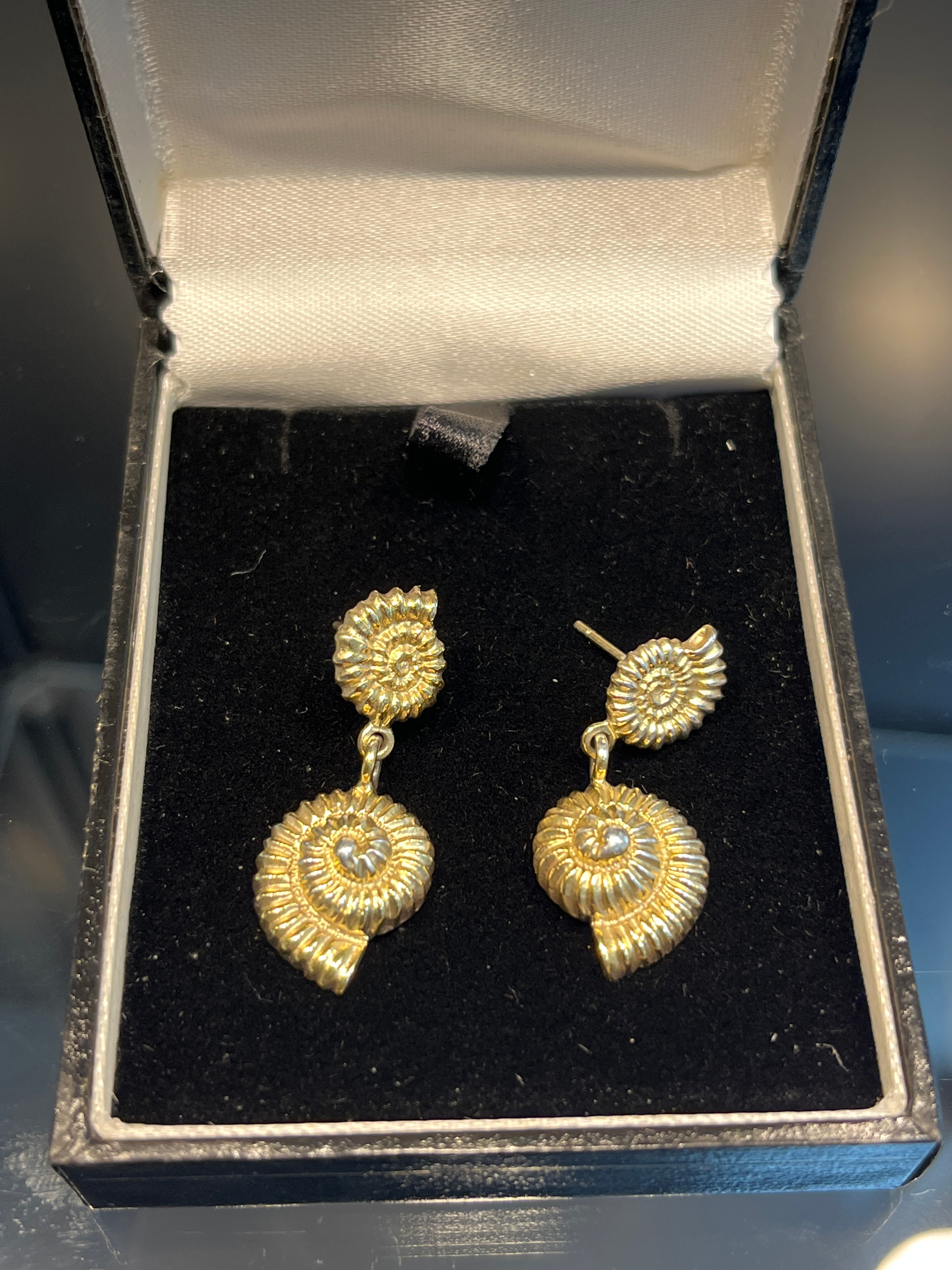 A Pair of heavy Edinburgh hall marked [possibly gilt silver] shell design earrings.