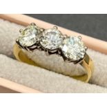 18ct yellow gold three stone diamond ring set in 18ct white gold, the three diamonds are round