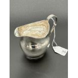 A Georgian London silver cream jug. [88.73grams]