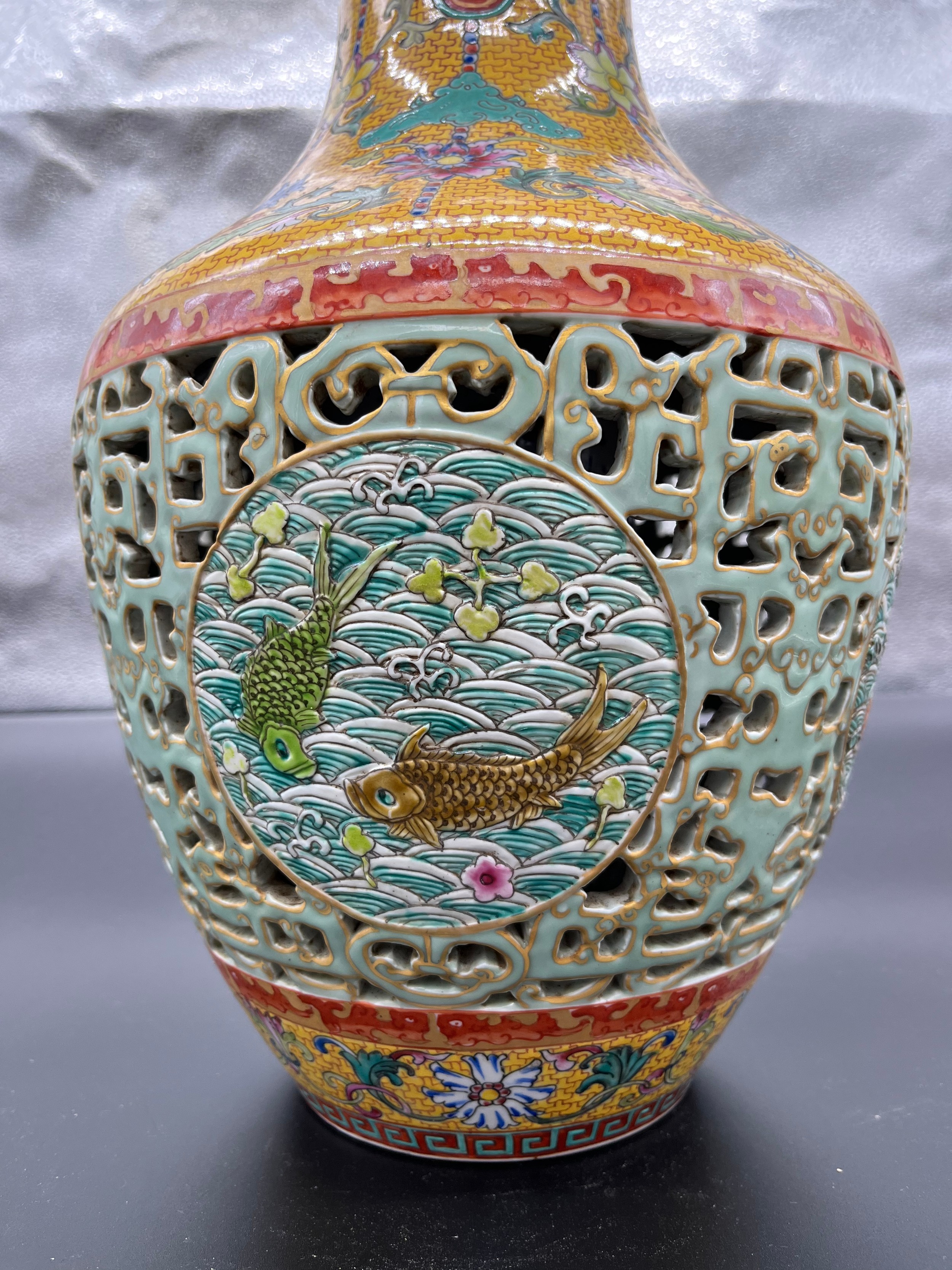 A Chinese Qianlong era marked vase. Yellow ground and pierced blue ground, Four panels depicting - Image 9 of 18
