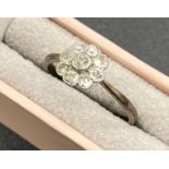 18ct gold and diamond cluster set ring. Millegrain set in white metal. [Ring size N] [2.04Grams]