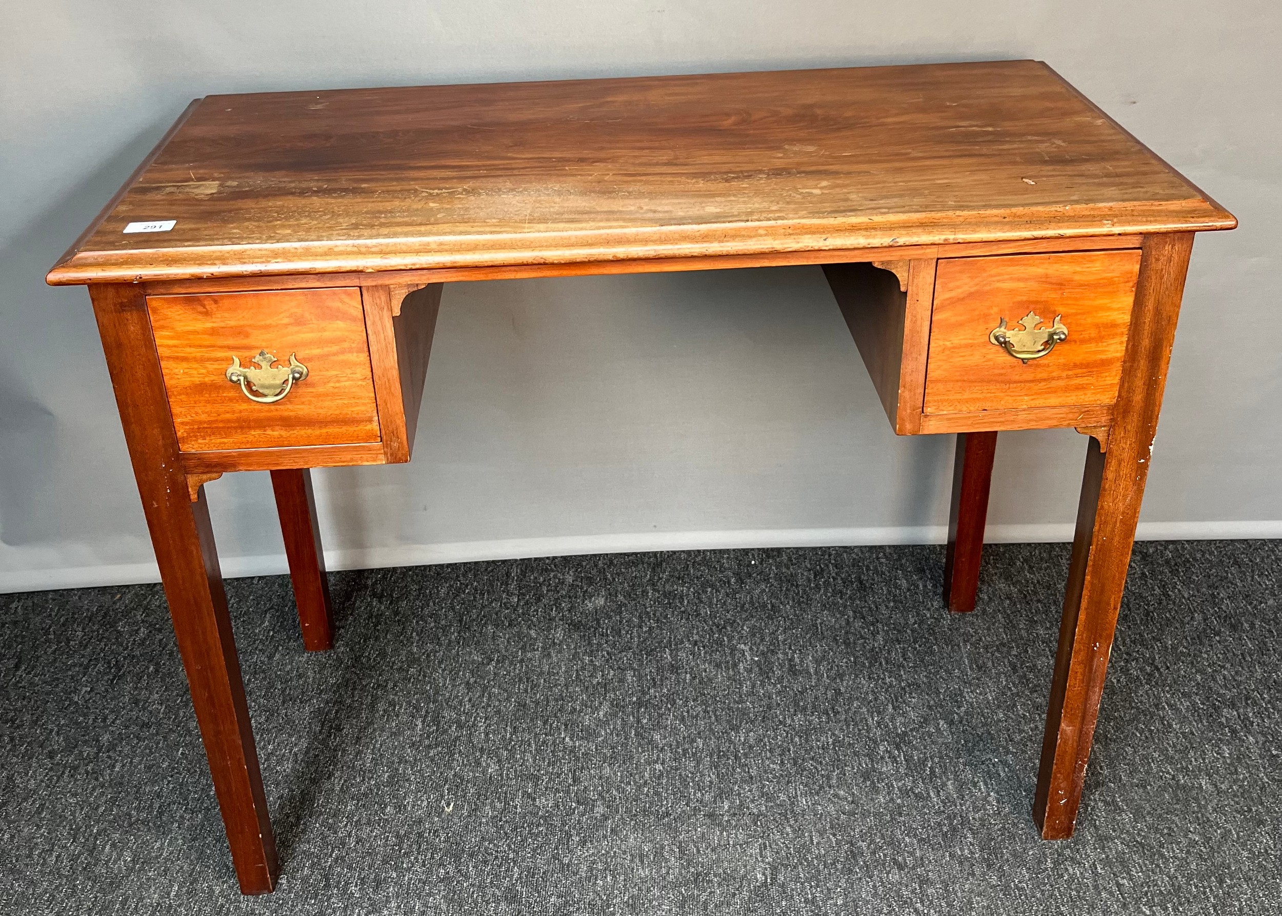 Antique style knee hole desk, the rectangular top above two small square drawers, raised on square