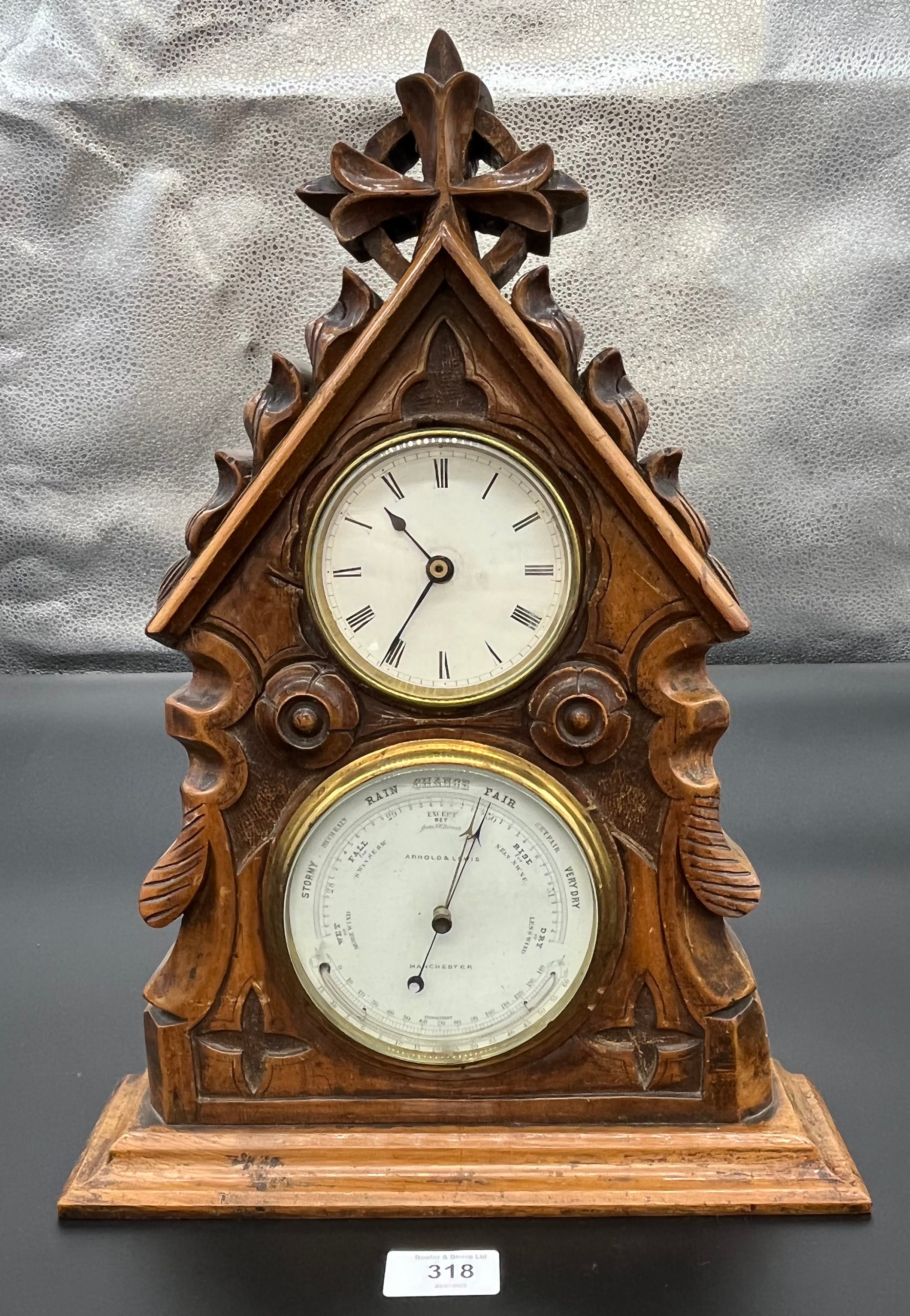 Antique hand carved mantel clock and barometer. Wooden case designed in a church style building.