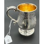 A Birmingham silver ornate drinking mug. Produced by Elkington & Co Ltd. [215.13grams] [10.5cm high]