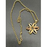 9ct gold ladies floral design pendant together with a 9ct gold belcher chain. Clasp replaced with