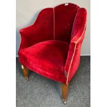Antique tub chair, the shell shaped back above a cushioned seat upholstered in red material,