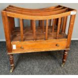 19th century Canterbury, the top with three storage sections, above a frieze drawer, raised on