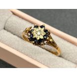 9ct gold, Sapphire and diamond ring. [Ring size M] [1.80Grams]