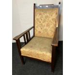 Antique fire side chair, the high back with cushioned support above open block arms with central