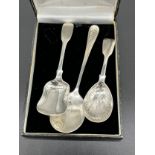 Two Georgian London silver caddy spoons together with a Birmingham silver condiment spoon. [57.