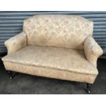 Antique parlour settee, the shaped back above a cushioned double seat upholstered in a neutral