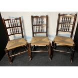 Lot of three antique chairs, the back with turned supports and spindles, above a rush seat, raised