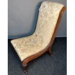 Antique nursing chair, the scroll cushioned back and seat upholstered in a neutral upholstery,