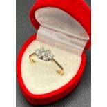 A Ladies 18ct yellow gold rectangle shaped diamond cluster ring set with three centre round