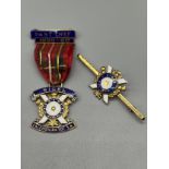 Two 9ct and enamel Scottish medals for Nigel Caledonian Society. [20.31Grams]