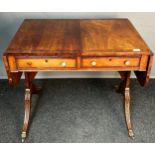 A Reproduction settee table, the rectangular top with drop ends and two pull out under drawers to