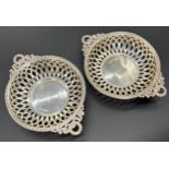 A Pair of Birmingham silver two handle pierced dishes. Ribbon and wreath design handles. Produced by