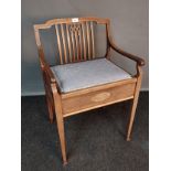 Edwardian mahogany inlaid piano stool, the shaped back with central stretchers above open scroll