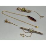 Four items of gold jewellery to include 9ct yellow gold bar brooch set with a single green stone,