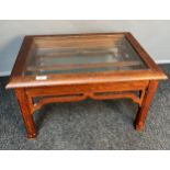 19th century oak glass table, the lift-up top held up by a bracket with a glass shelf base above a