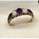 Ladies antique 9ct yellow gold ring set with three amethyst and two opal stones. Stone set within an