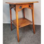 Arts and crafts oak size table, the square top above carved peripheral apron and supporting square