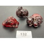 Three Japanese hand carved cherry amber netsukes. All signed to the base. [Cat- 5cm in length] [0.