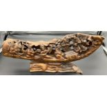 A Large Chinese hand carved bamboo root depicting figures upon a sailing boat. [28cm in height, 60cm