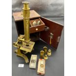 Antique brass table top microscope, comes with various lenses, slides, and original carry box.