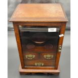 Antique oak cased table top smokers cabinet. Designed with interior drawers and rest areas. [