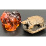 A Japanese hand carved amber netsuke of a rabbit family, signed by the artist. Together with a