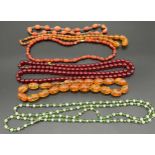 A Selection of vintage graduating bead necklaces, to include amber and cherry amber beads & glass