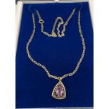 9Ct yellow gold belcher style necklace together with a 9ct gold and pale purple stone pendant. [15.