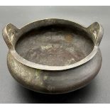 A Chinese bronze three foot censor burning pot. Impressed six signature mark to base. [10x16x16cm]