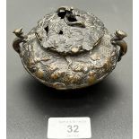A Chinese bronze incense burner supported on bun feet. [8x11x9.5cm]