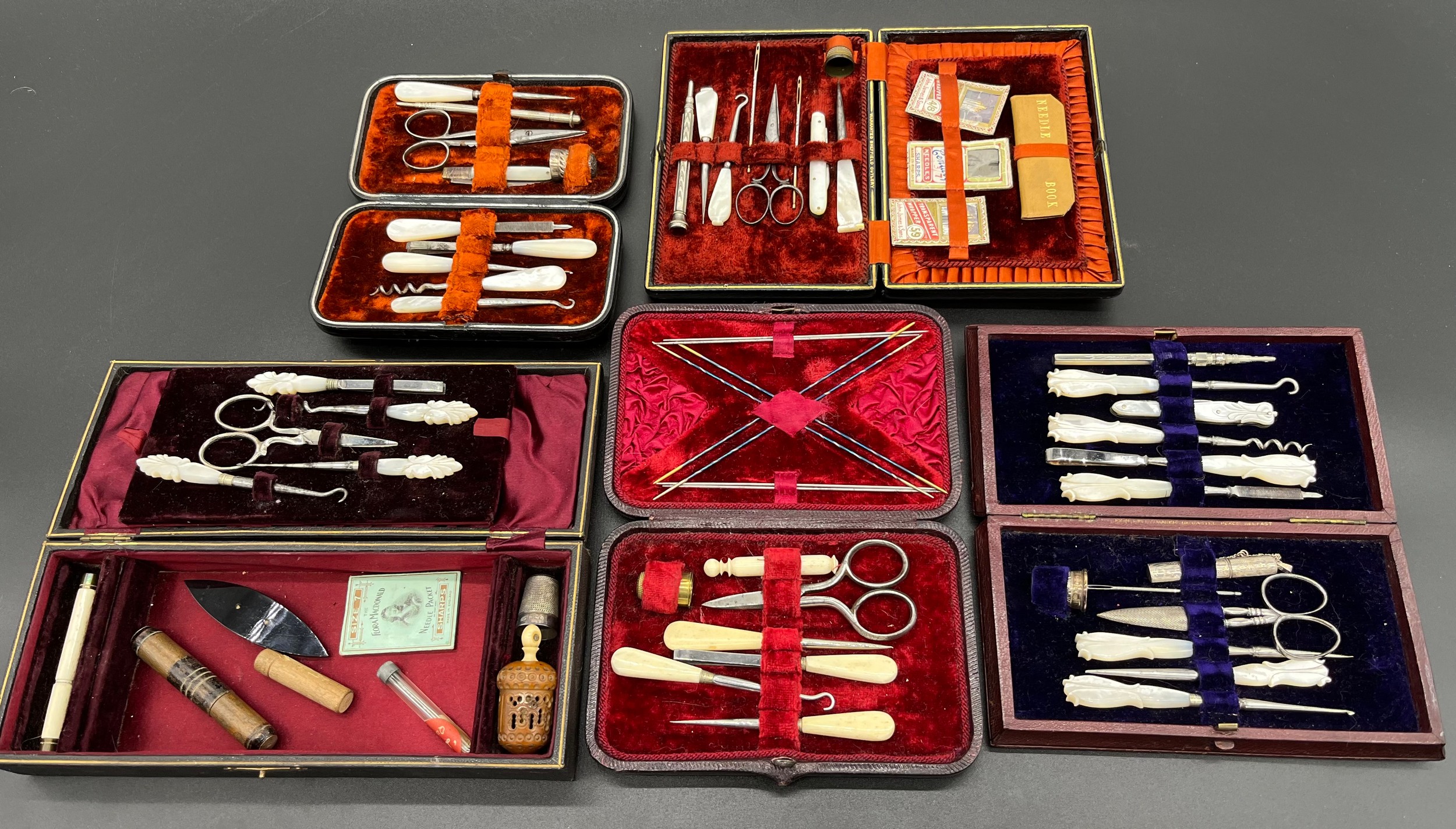 A Lot of cased/ boxed manicure/ sewing utensils. Includes mother of pearl handles tools and silver