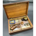 A Carved top document box containing various collectables, Fruit wood netsuke- signed, Mauchline