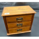 A Small antique pine three drawer apprentice chest. Containing various odds, Shell purse, Brass