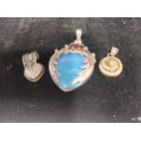 Three various silver pendants. [Will post]