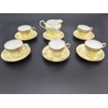 Twelve piece Aynsley bone china tea set in a yellow floral design