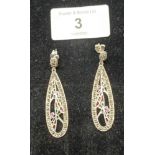 A pair of silver marcastie and ruby cabochon drop earrings