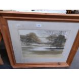 Large forest scene print with lake in fitted frame .
