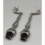 A Pair of Art Deco design silver, marcasite and garnet set earrings.