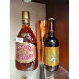 Bottle of Glayva liqueur together with bottle of golden jubilee ale .