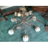 Large modern rustic 6 branch ceiling light fitted with frosted flower glass shades .